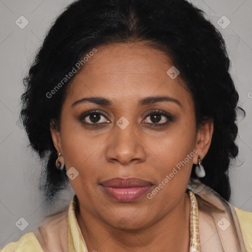 Joyful latino adult female with medium  brown hair and brown eyes