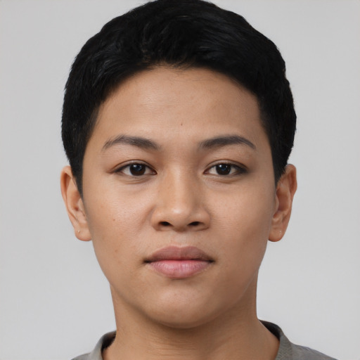 Joyful latino young-adult female with short  black hair and brown eyes