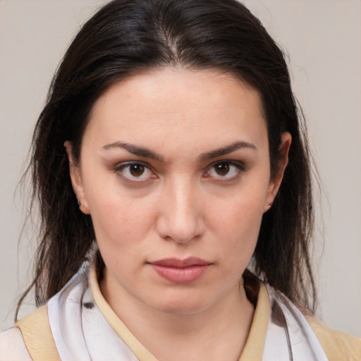 Neutral white young-adult female with medium  brown hair and brown eyes