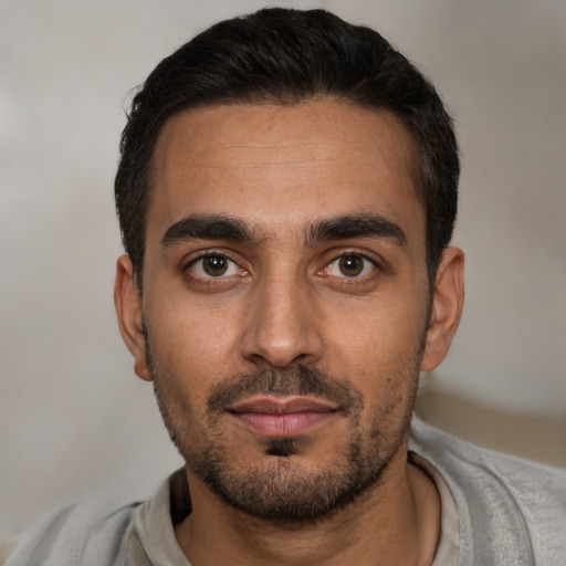 Neutral white young-adult male with short  black hair and brown eyes