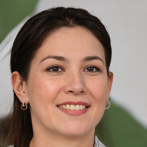 Joyful white young-adult female with medium  brown hair and brown eyes