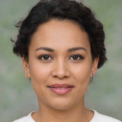 Joyful latino young-adult female with short  brown hair and brown eyes