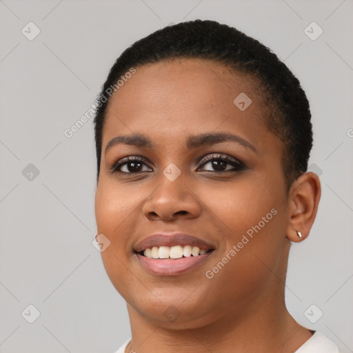 Joyful black young-adult female with short  black hair and brown eyes