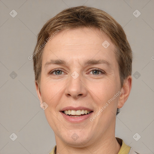 Joyful white adult female with short  brown hair and grey eyes