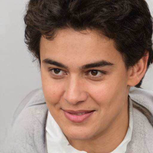 Joyful white young-adult male with medium  brown hair and brown eyes