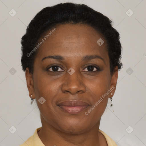 Joyful black adult female with short  brown hair and brown eyes