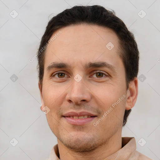 Joyful white adult male with short  brown hair and brown eyes