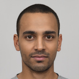 Neutral latino young-adult male with short  black hair and brown eyes
