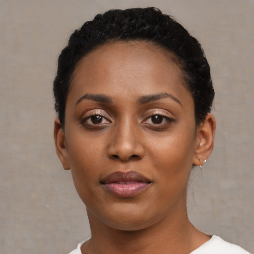 Neutral black young-adult female with short  black hair and brown eyes