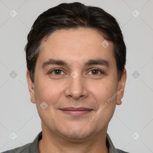 Joyful white adult male with short  brown hair and brown eyes