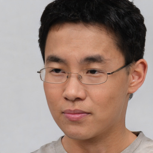 Neutral asian young-adult male with short  black hair and brown eyes
