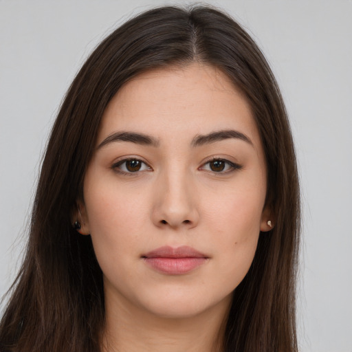 Neutral white young-adult female with long  brown hair and brown eyes