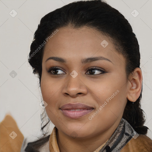 Joyful black young-adult female with long  black hair and brown eyes