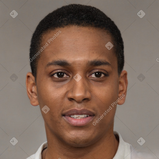 Joyful black young-adult male with short  brown hair and brown eyes