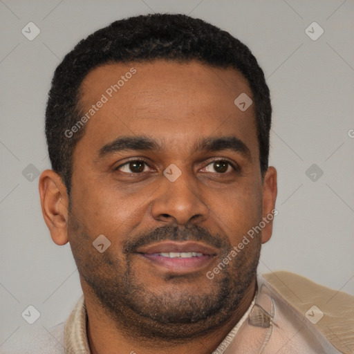 Joyful latino young-adult male with short  brown hair and brown eyes