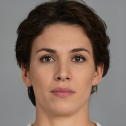 Neutral white young-adult female with short  brown hair and brown eyes