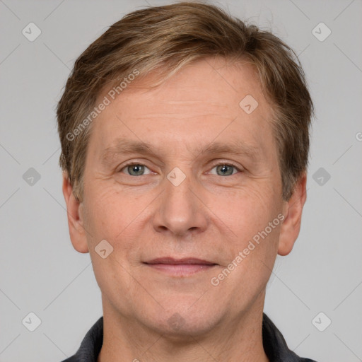 Joyful white adult male with short  brown hair and grey eyes