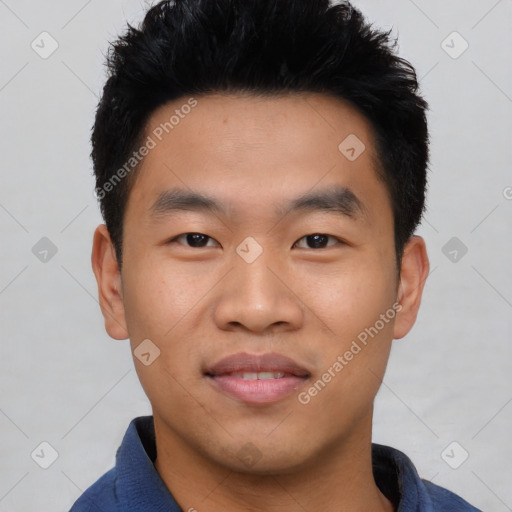 Joyful asian young-adult male with short  black hair and brown eyes