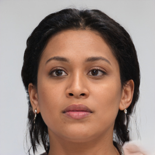 Neutral latino young-adult female with medium  brown hair and brown eyes