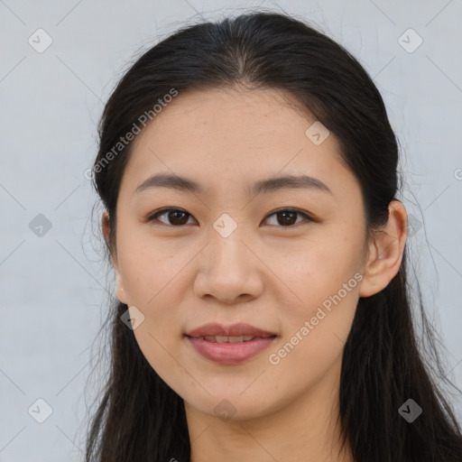 Joyful asian young-adult female with long  brown hair and brown eyes