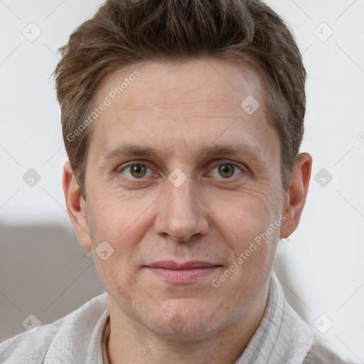 Joyful white adult male with short  brown hair and grey eyes