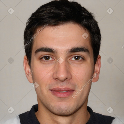 Joyful white young-adult male with short  black hair and brown eyes