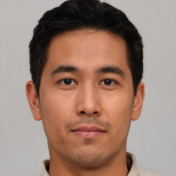 Neutral asian young-adult male with short  brown hair and brown eyes