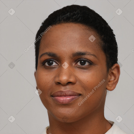 Joyful black young-adult female with short  black hair and brown eyes