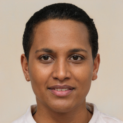 Joyful latino young-adult female with short  black hair and brown eyes