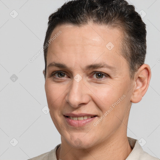 Joyful white adult female with short  brown hair and brown eyes