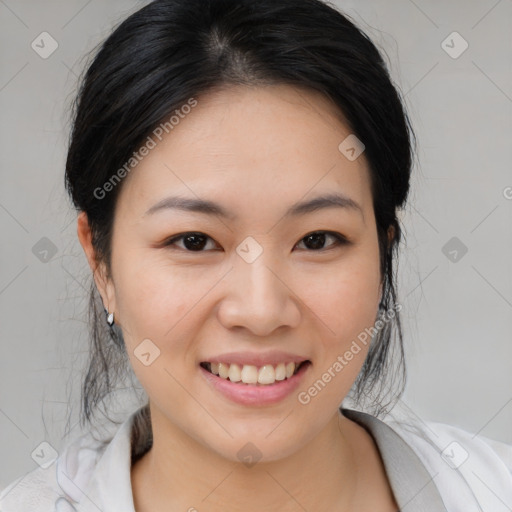 Joyful asian young-adult female with medium  black hair and brown eyes