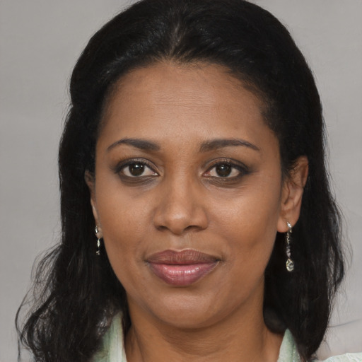 Joyful black young-adult female with medium  brown hair and brown eyes