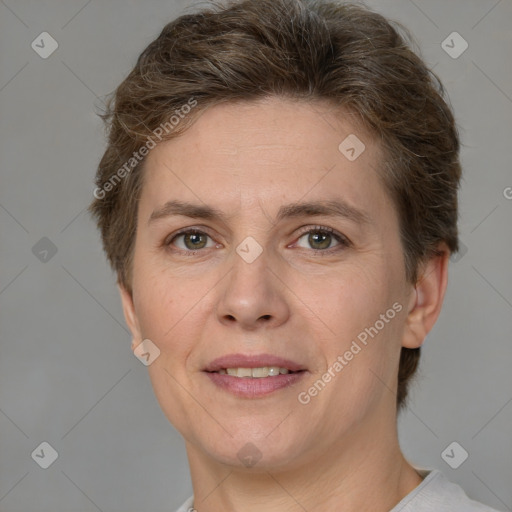 Joyful white adult female with short  brown hair and brown eyes