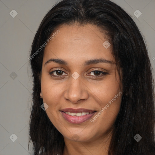 Joyful latino young-adult female with long  brown hair and brown eyes