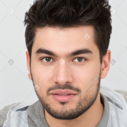 Neutral white young-adult male with short  brown hair and brown eyes