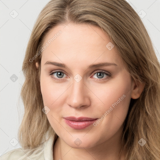 Joyful white young-adult female with long  brown hair and blue eyes