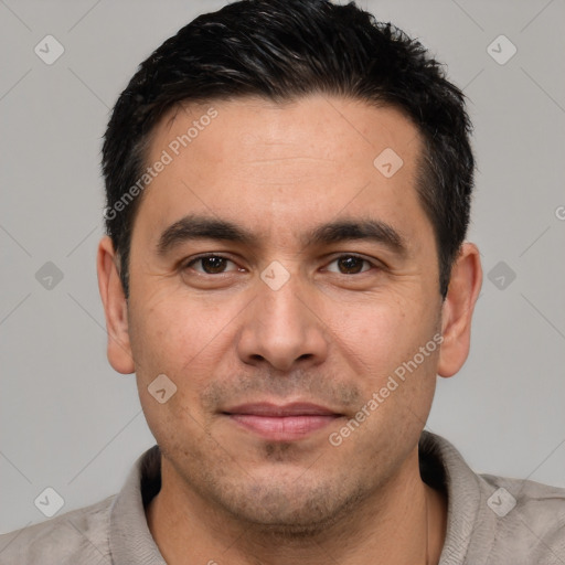 Joyful white young-adult male with short  black hair and brown eyes