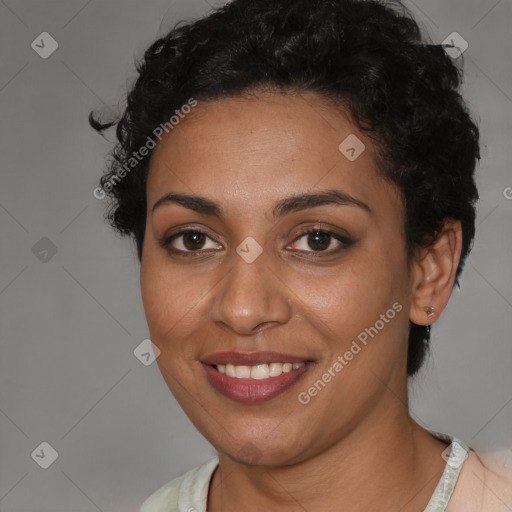 Joyful latino young-adult female with short  brown hair and brown eyes