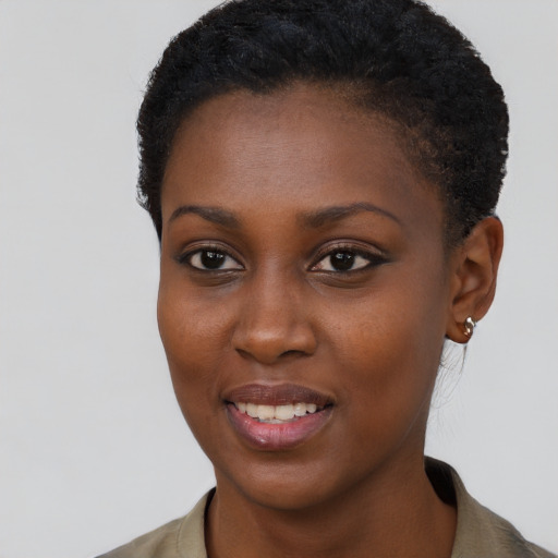 Joyful black young-adult female with short  brown hair and brown eyes