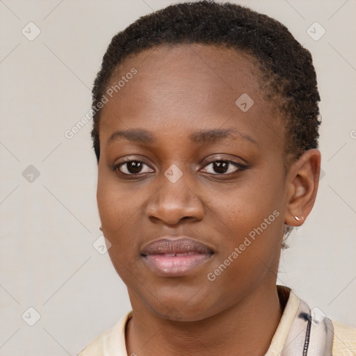 Joyful black young-adult female with short  brown hair and brown eyes