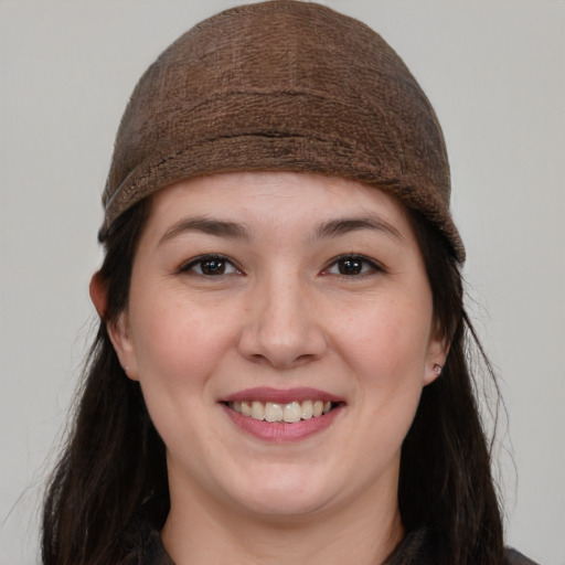 Joyful white young-adult female with long  brown hair and brown eyes