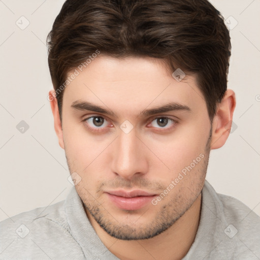 Neutral white young-adult male with short  brown hair and brown eyes