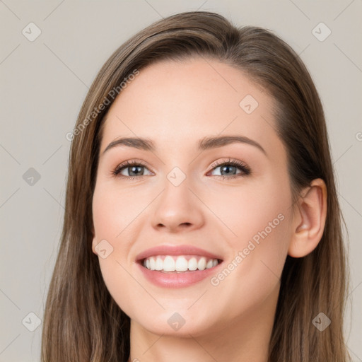 Joyful white young-adult female with long  brown hair and grey eyes