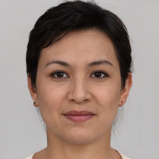 Joyful asian young-adult female with short  black hair and brown eyes