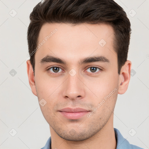 Neutral white young-adult male with short  brown hair and brown eyes