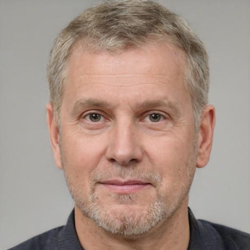 Joyful white middle-aged male with short  brown hair and grey eyes