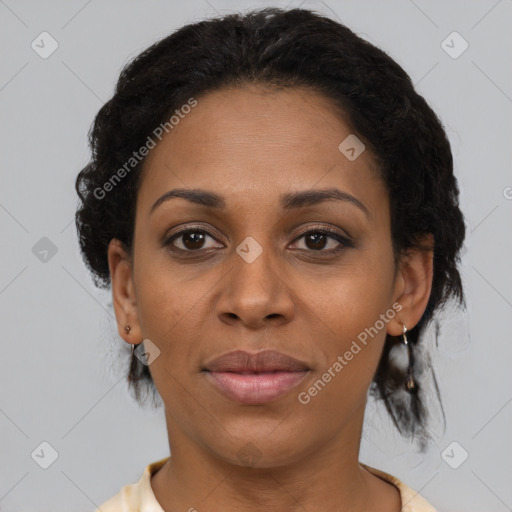 Joyful black adult female with short  brown hair and brown eyes