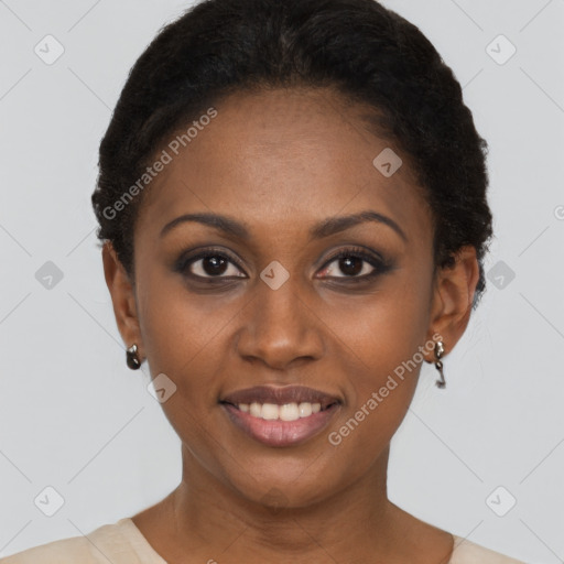 Joyful black young-adult female with short  black hair and brown eyes