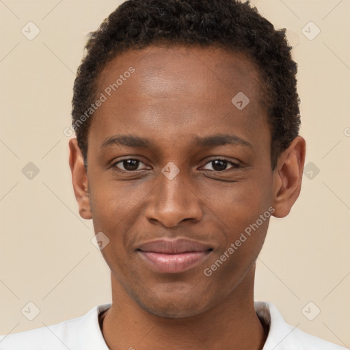 Joyful black young-adult male with short  brown hair and brown eyes