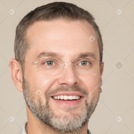 Joyful white adult male with short  brown hair and brown eyes